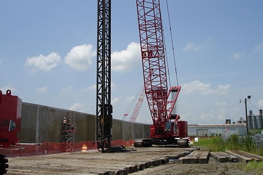 used crane mats at worksite for large commercial construction project